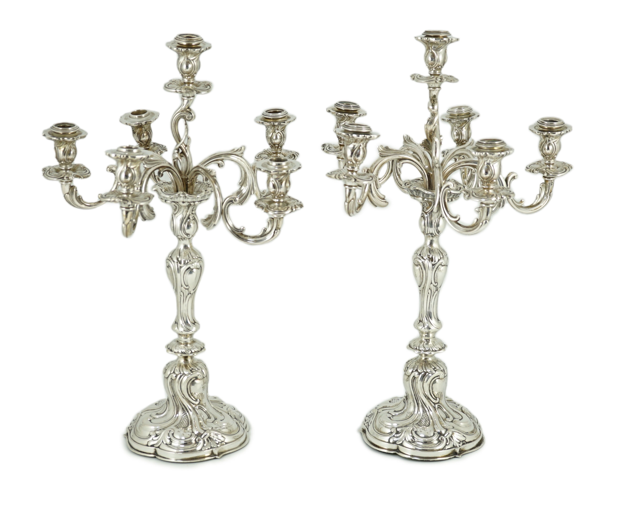 A pair of late 19th century German 800 standard white metal Rococo style, five branch, six light candelabra, by Vollgold